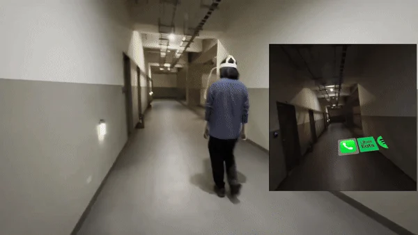 A person walking down a hallway with augmented-reality gesture feedback